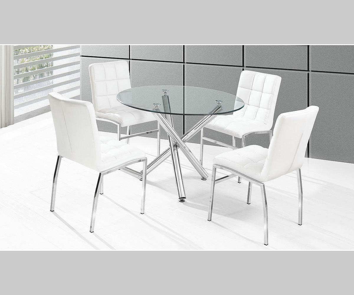 Round glass dining table with four white chairs in a modern setting.