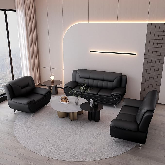 Modern living room with black leather sofa set and round coffee table.
