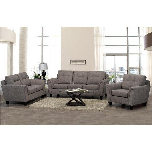 Gray sofa set in a living room with a coffee table and decor items.
